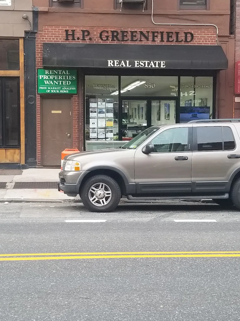 H.P. Greenfield Real Estate storefront office on a Brooklyn street